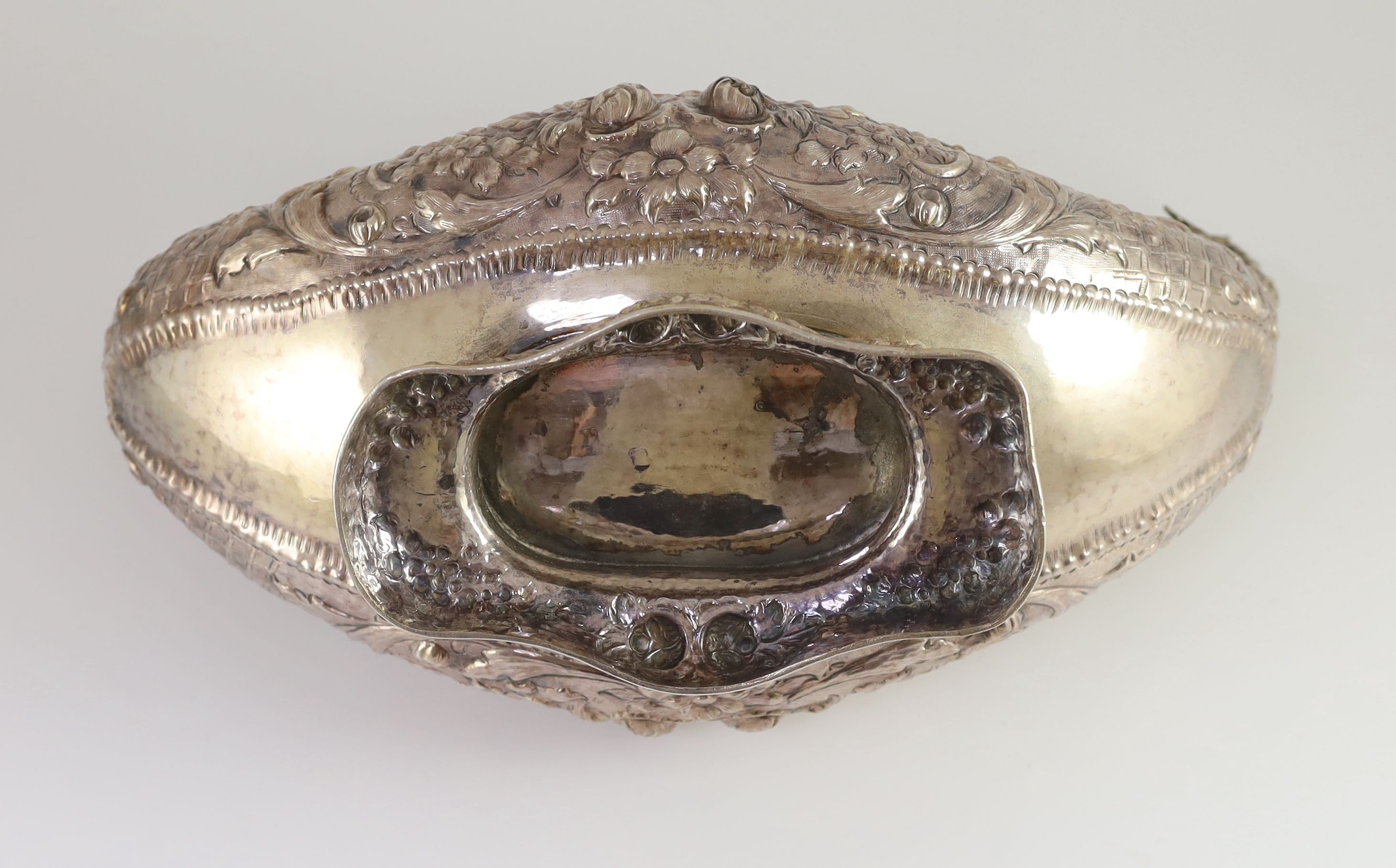 A 20th century Continental embossed 900 standard silver boat shaped centrepiece bowl
